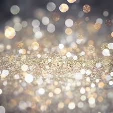 A Silver Glitter Background With A Gold