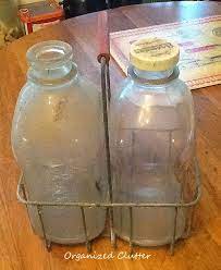 Vintage Glass Milk Bottles In A Wire