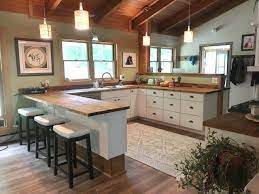 u shaped kitchen with exposed beams