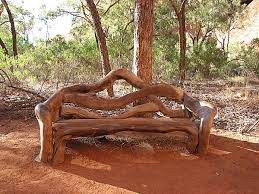 Bench Carved Out Of Wood For Outdoors