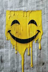 Yellow Paint Dripping On The Newspaper