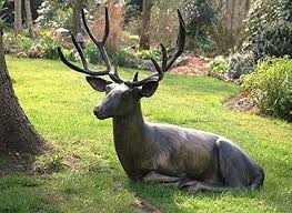 Garden Sculpture Of Lying Down Deer