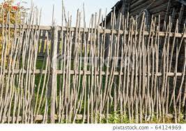 Wicker Rustic Wooden Fence In Village