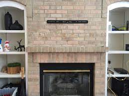 Tv On Brick Above A Fireplace