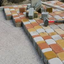 Laying Paving Slabs By Mosaic Close Up