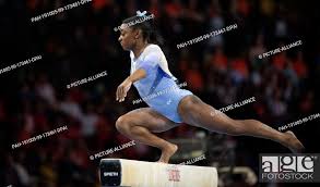 doing balance beam gymnastics stock