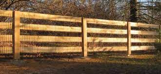 wood post rail fencing in