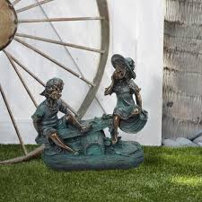 Alpine Girl And Boy Playing On Teeter Totter Statue