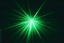 green laser beam against black dark
