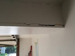 ceiling and support beam damage in garage