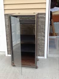 Repurpose A Dated Stereo Glass Cabinet