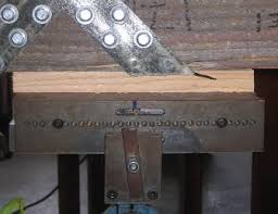 wood buffer for frp x braced beams