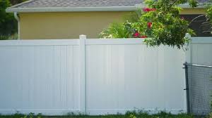 White Vinyl Fence Surrounding Private