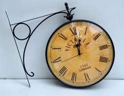 Wooden Wall Clock With Brass Frame At