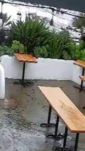Flood Waters Rush Into Outdoor Patio Of
