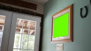 A Green Screen Picture Frame Hanging On