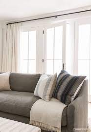 Gray Couch White Walls White Curtains