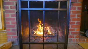 Fire In Brick Fireplace In Old Cabin