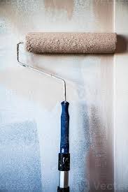 Paint Roller On The Wall 4294687 Stock