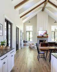 white vaulted ceilings with wood beams