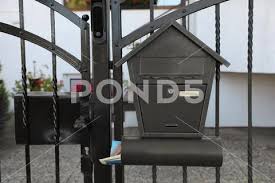 Black Metal Letter Box On Fence