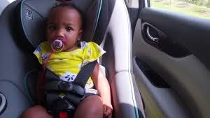 Baby Riding In Car Seat Stock