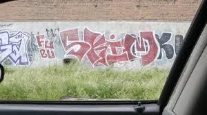 Driving By Urban Graffiti Wall