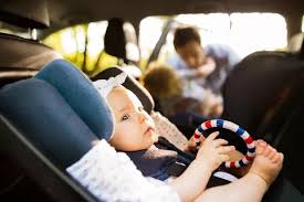 Child Sit In The Front Seat Of The Car