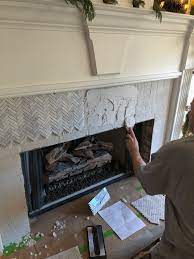Herringbone Marble Tile To A Fireplace
