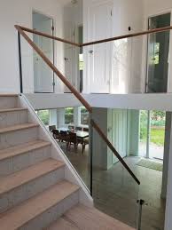 Glass Railing With A Wood Cap Rail