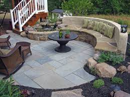 Outdoor Paver Patio With A Stone Bench
