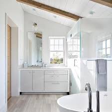 sloped shiplap ceiling with wood beams