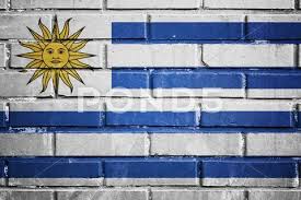 Uruguay Flag On A Textured Brick Wall