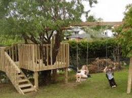 Treehouse With A Slide And Swing Set