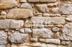 Brown Stone Wall Made Of Irregularly