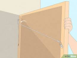 How To Hang Artwork With Wire Simple