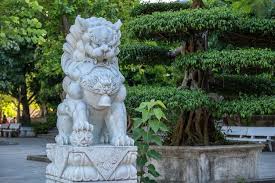 Marble White Lion Statue In Outdoors