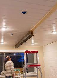 install wood barn beams on a ceiling