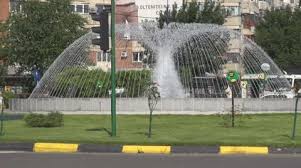 Water Fountain Downtown In Traffic