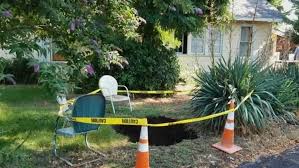 Sinkhole Opens Up In Front Yard Of A