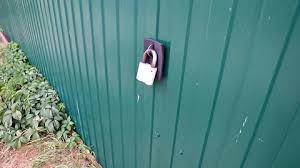 Metal Lock On The Garden Fence Stock