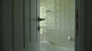 White Bathroom Door Left Ajar And
