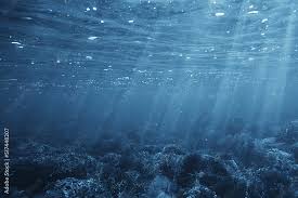 Sun Rays Under Water Blue Ocean