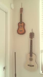 Guitars Hanging On Wall Just Used