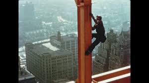 1950s construction worker climbs