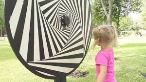 Little Girl Plays With Hypnotic Spiral