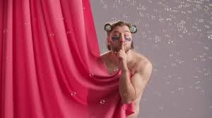 Seminude Man Covered By Pink Shower