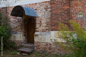 Porch Of An Old Brick House With An
