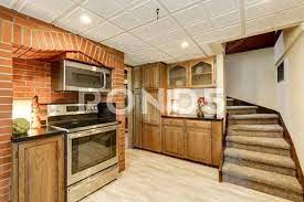Kitchen Area With Red Brick Wall And