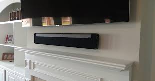 Tv And Sonos Playbar Mounted Over Fireplace